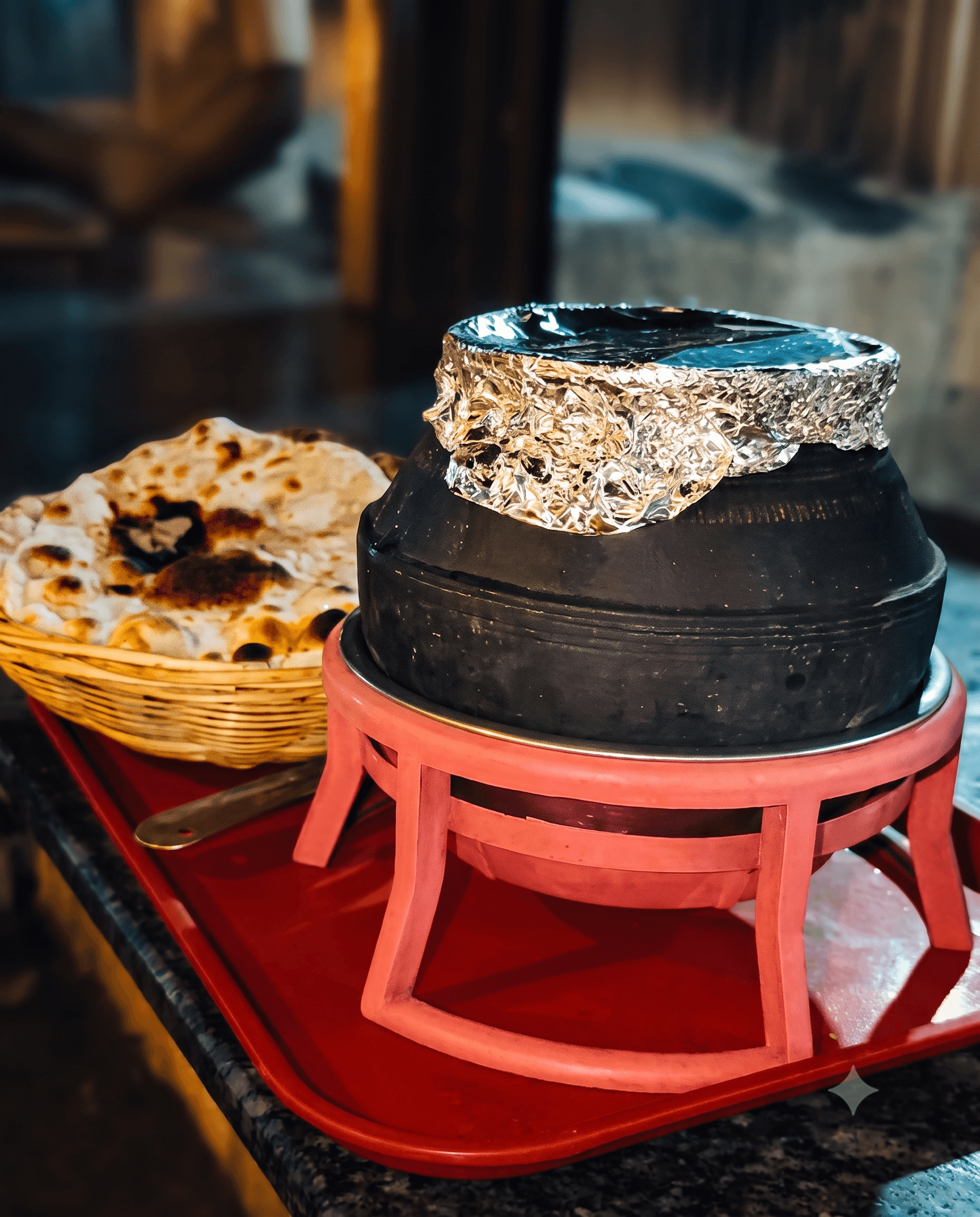 A sealed Champaran Mutton clay handi served at the table with fresh bhakri at Hotel Chul, Aurangabad